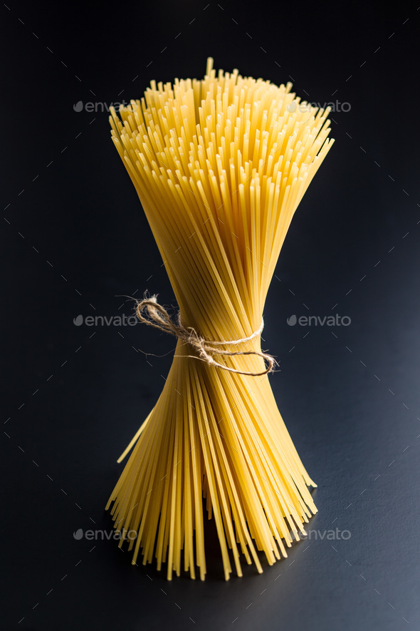 Uncooked spaghetti pasta. Stock Photo by jirkaejc PhotoDune